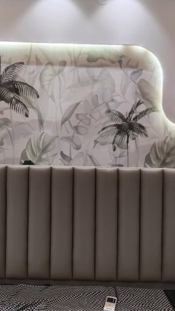 Botanical wallpaper and upholstered headboard installed by Bhawna Handloom